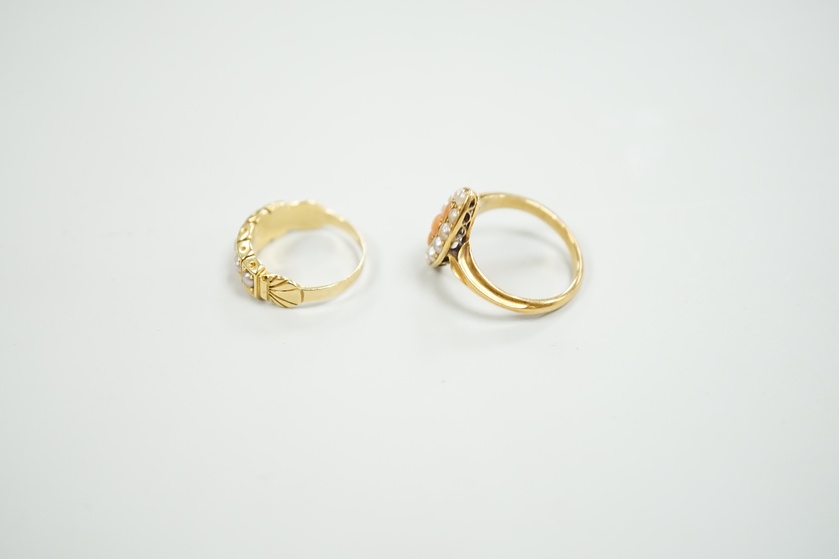 A late Victorian yellow metal, split pearl and coral set marquise shaped ring, size L and a similar yellow metal and split pearl set half hoop ring, gross weight 8 grams.